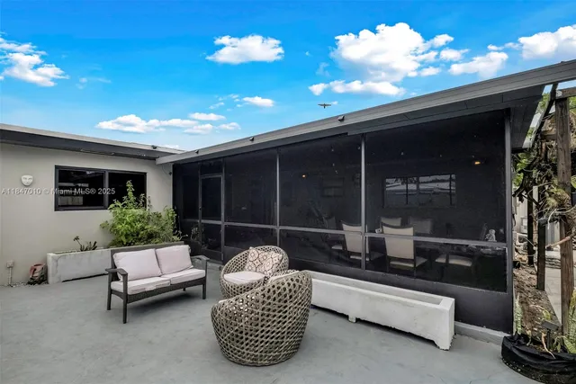 a outdoor living space with furniture and a potted plant