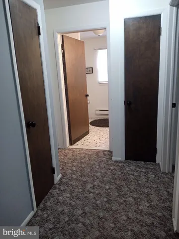 a bathroom with a sink vanity and a mirror