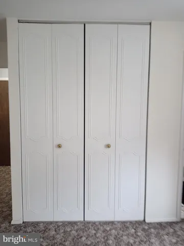 a backyard of a house with lots of green space and fountain