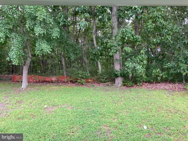 a view of a golf course with a lake