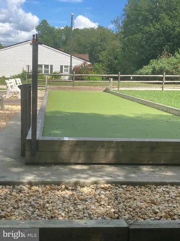 a view of park with large trees