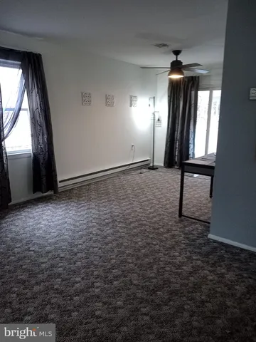 a view of an empty room and window