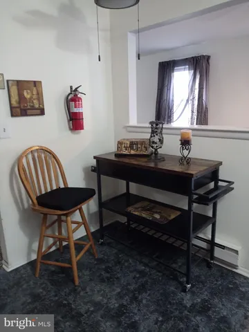 a view of a workspace with furniture