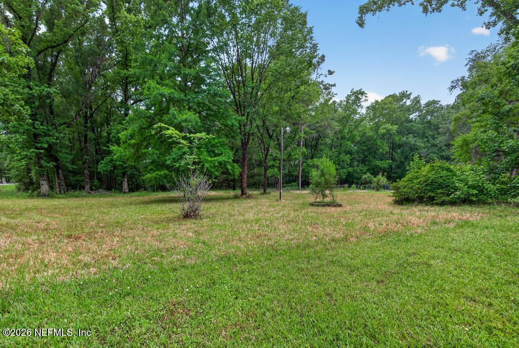 43739 Ratliff Road Callahan, FL 32011 - Photo 15 of 55 a backyard of a house with lots of green space