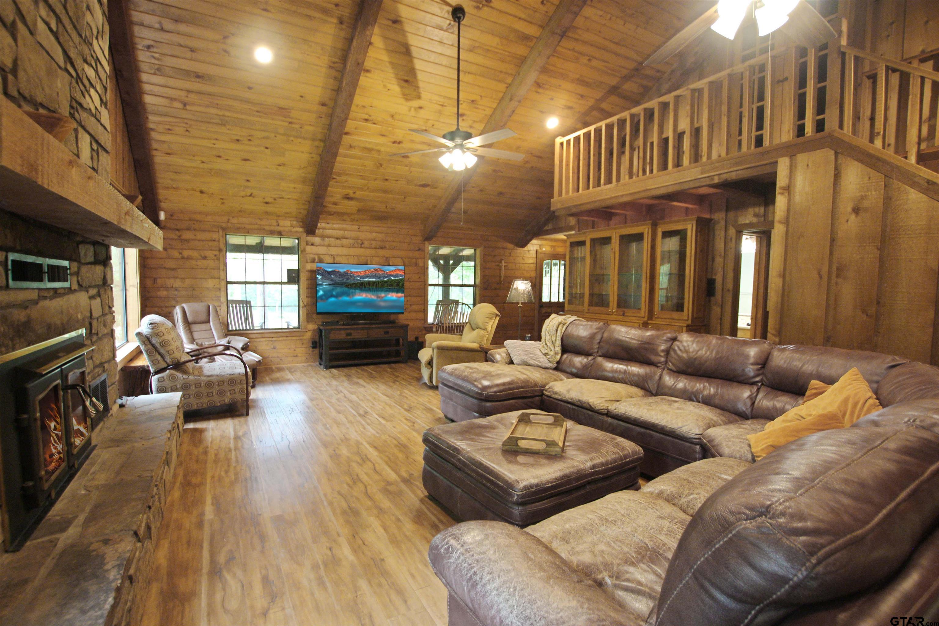782 Rosie Wady Road Gladewater, TX 75647 - Photo 5 of 48 a living room with furniture and a fireplace