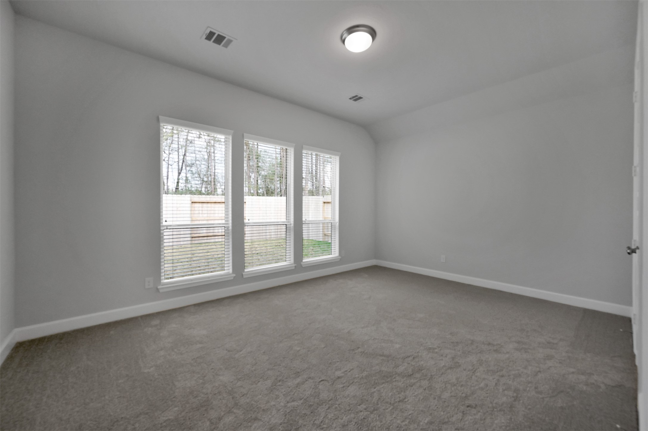 15715 Autumn Sun Conroe, TX 77302 - Photo 13 of 23 an empty room with a window