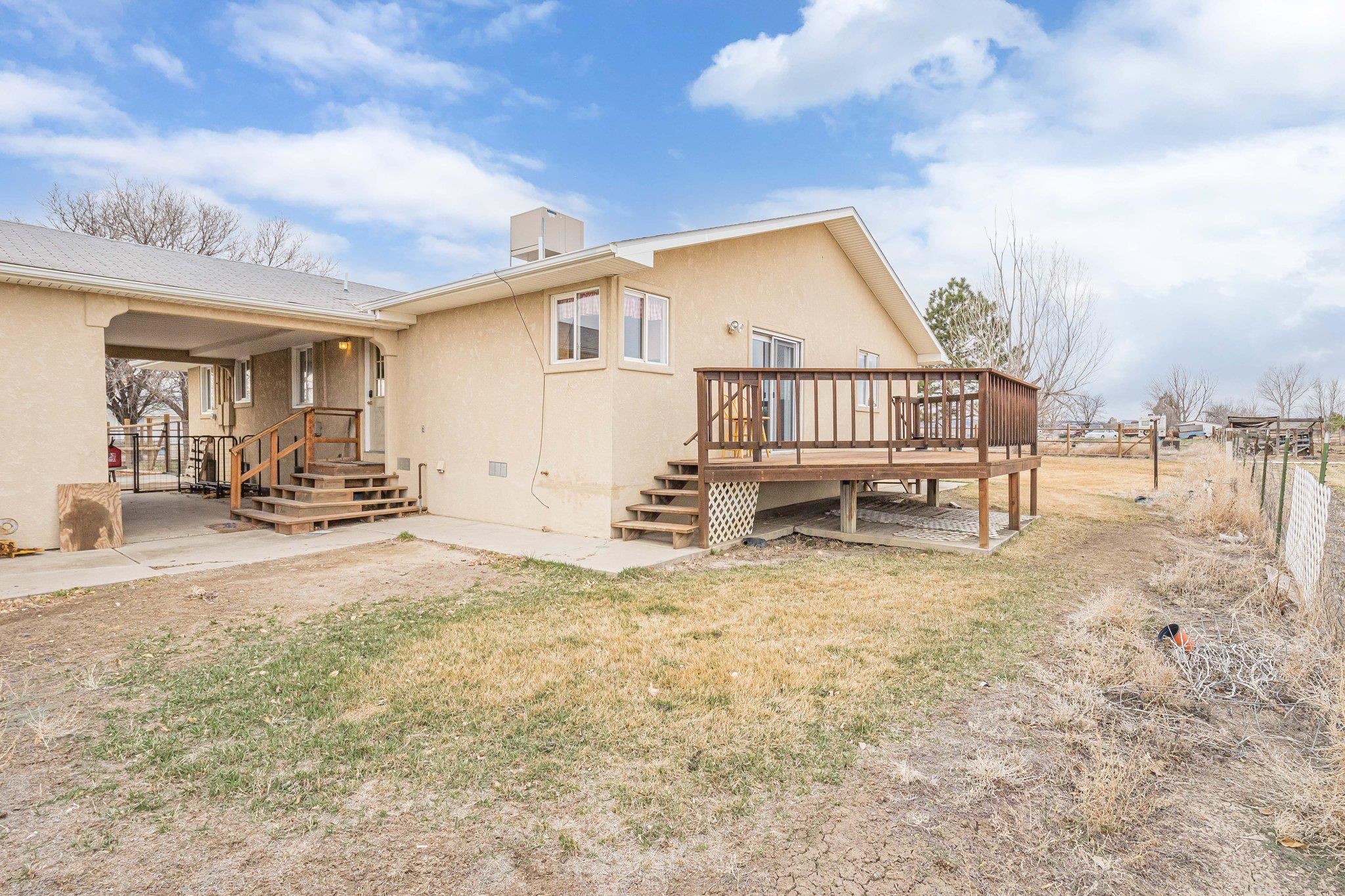 1895 L Road Fruita, CO 81521 - Photo 1 of 29 a view of a house with backyard and sitting area
