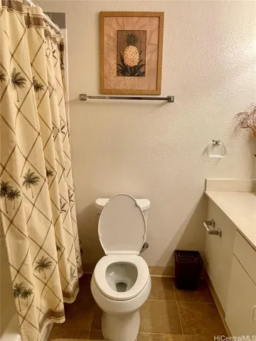 a bathroom with a toilet and a sink