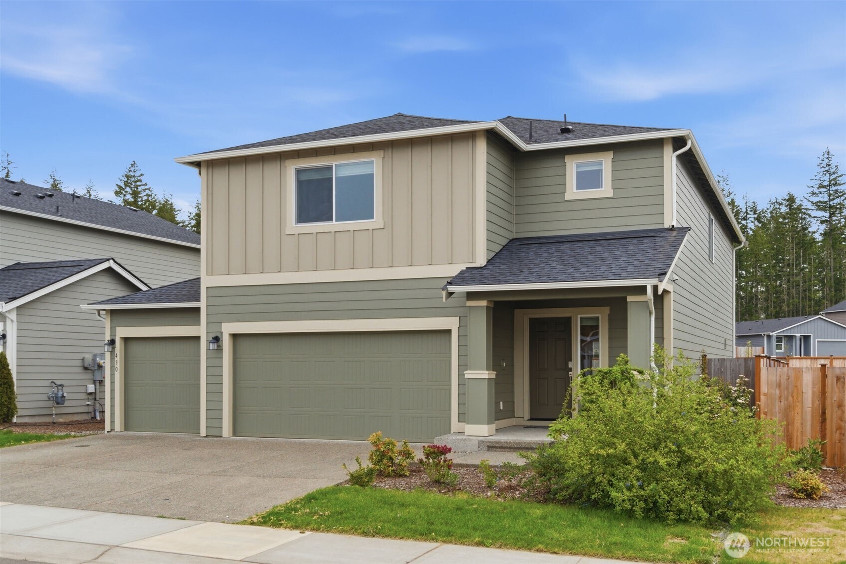 430 Northeast Ridge Point Boulevard Belfair, WA 98528 - Photo 2 of 39 front view of a house with a yard