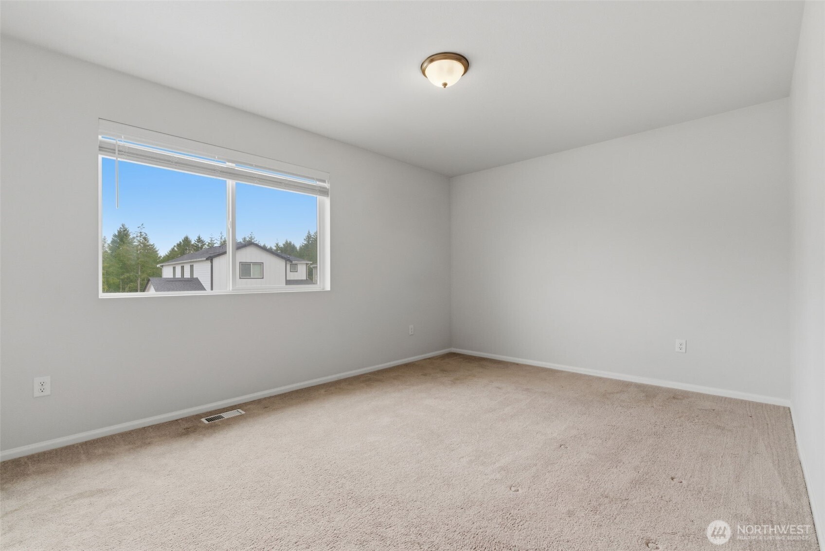 430 Northeast Ridge Point Boulevard Belfair, WA 98528 - Photo 29 of 39 an empty room with a window