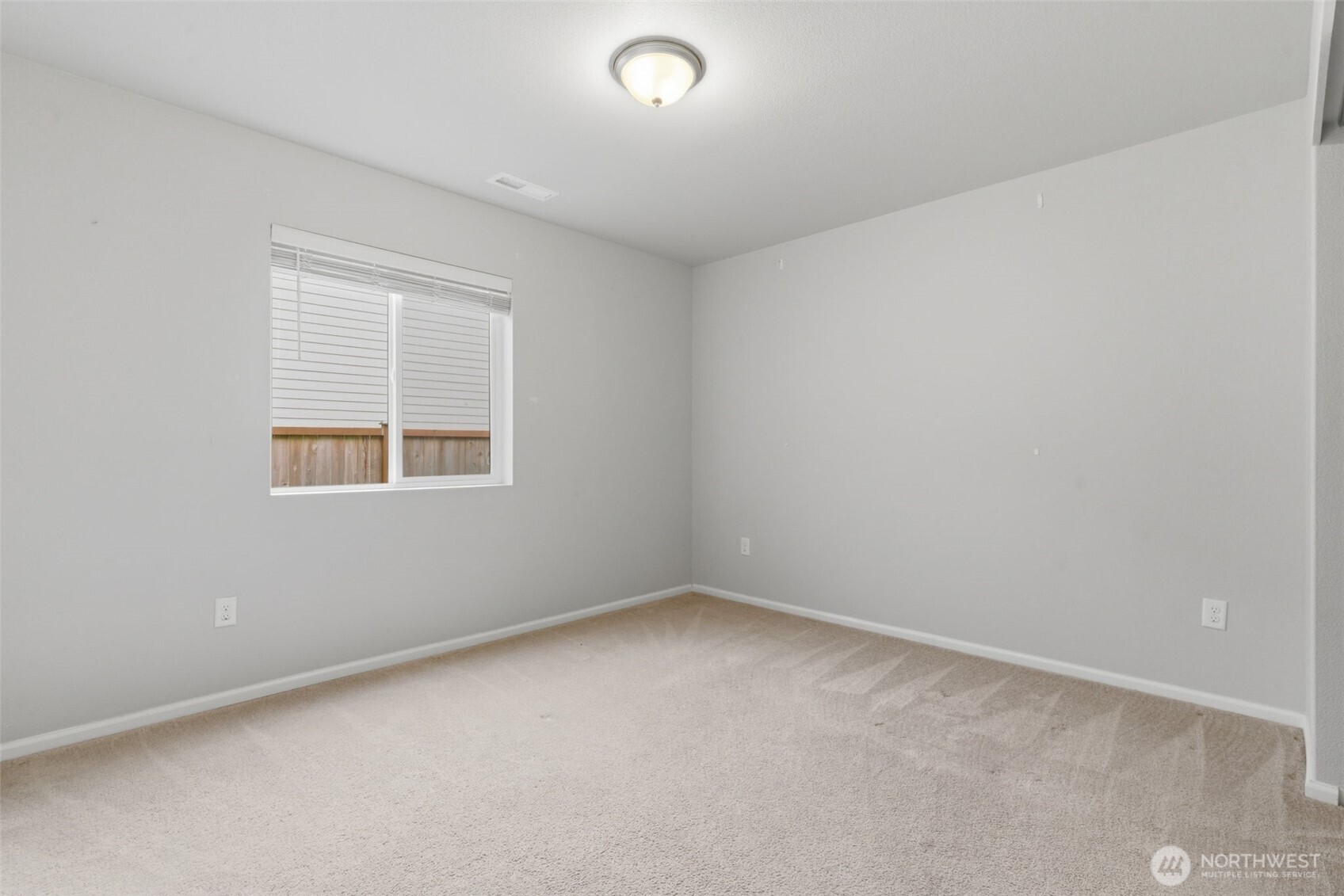 430 Northeast Ridge Point Boulevard Belfair, WA 98528 - Photo 5 of 39 an empty room with a window