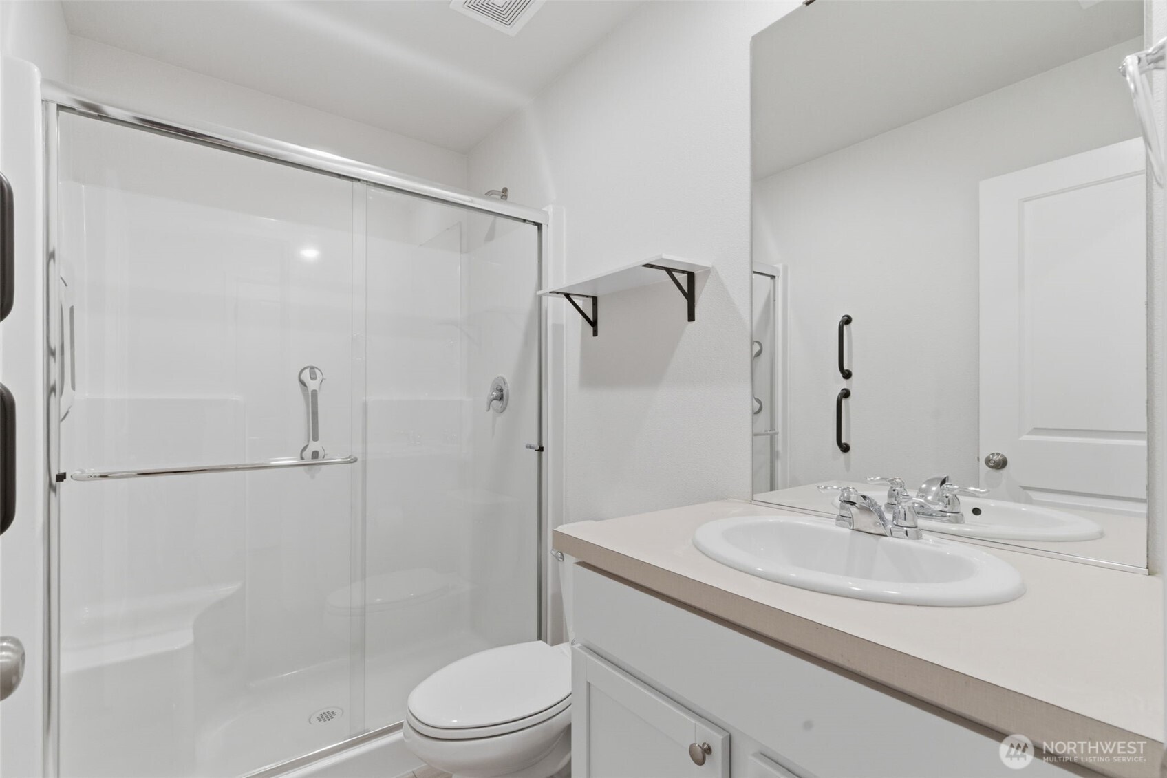 430 Northeast Ridge Point Boulevard Belfair, WA 98528 - Photo 7 of 39 a bathroom with a sink toilet and shower
