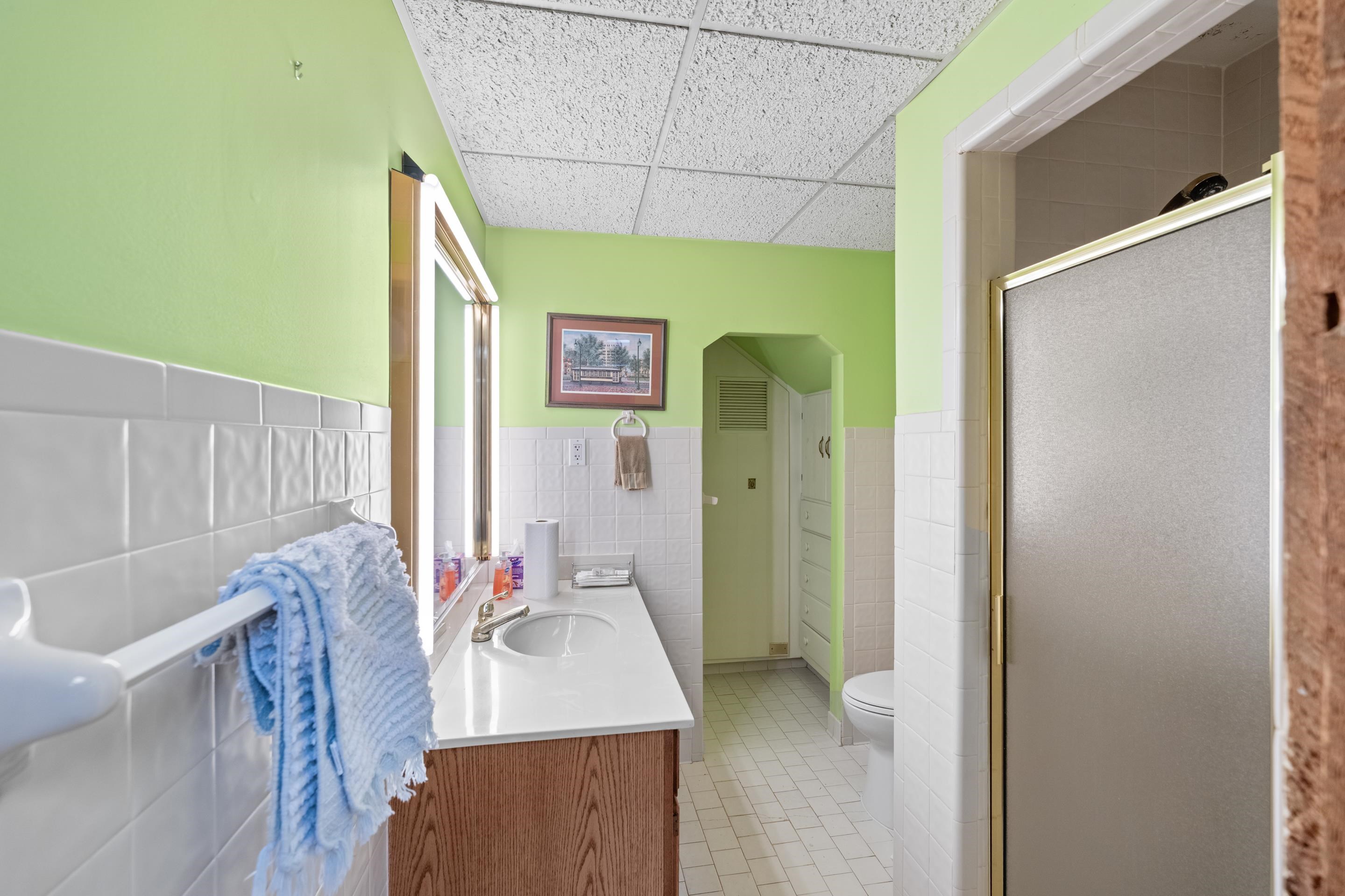 2989 Little John Road Millington, TN 38053 - Photo 19 of 34 a bathroom with a tub sink and mirror