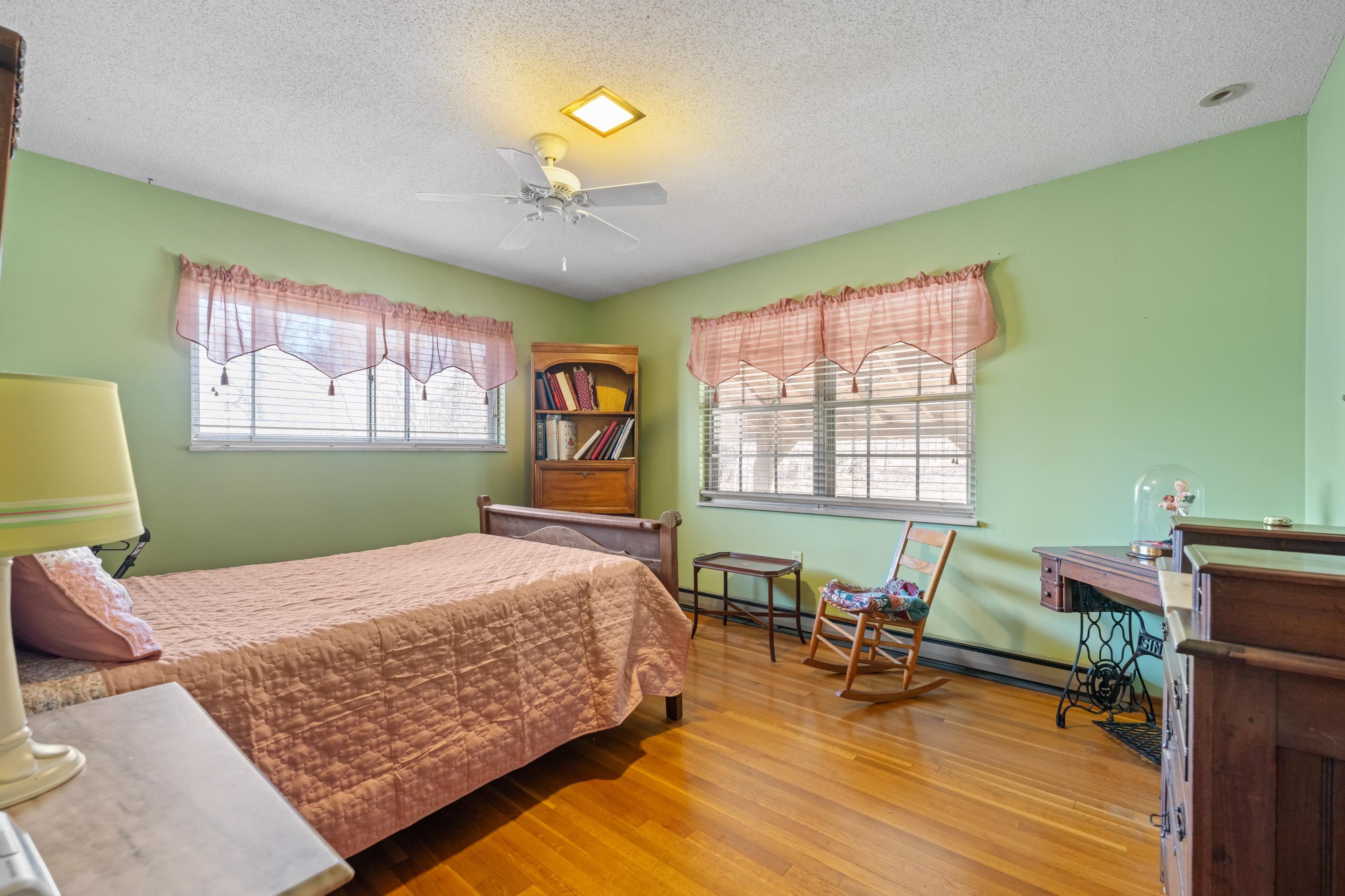 2989 Little John Road Millington, TN 38053 - Photo 21 of 34 a bedroom with furniture and a wooden floor
