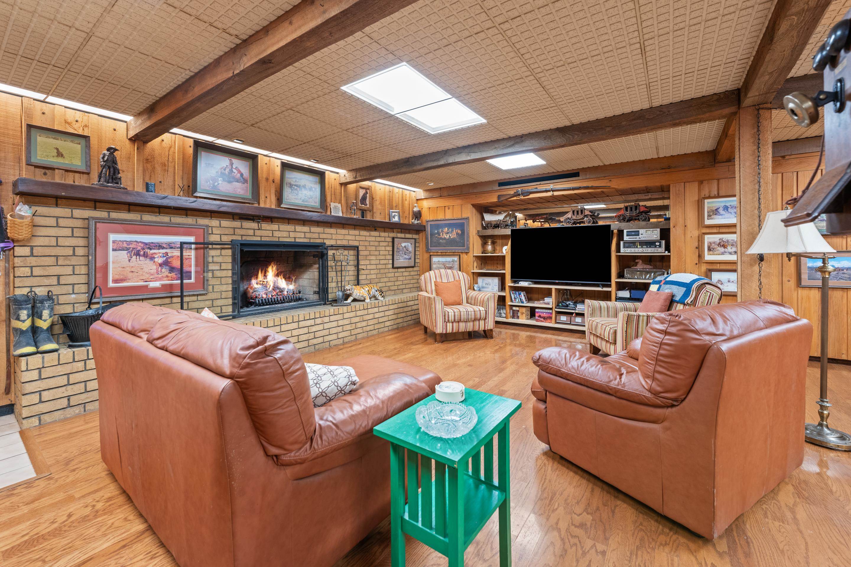 2989 Little John Road Millington, TN 38053 - Photo 3 of 34 a living room with furniture a flat screen tv and a fireplace