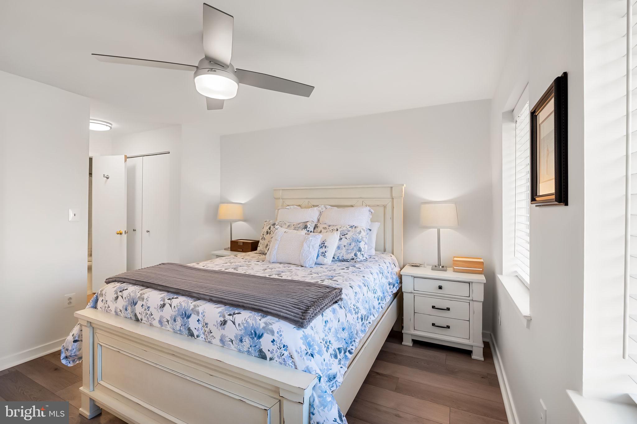 120 West Barre Street, Unit R 042 Baltimore, MD 21201 - Photo 12 of 32 a bedroom with a bed and a chandelier