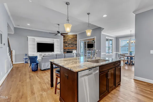 a bathroom with a granite countertop sink a large mirror and a shower