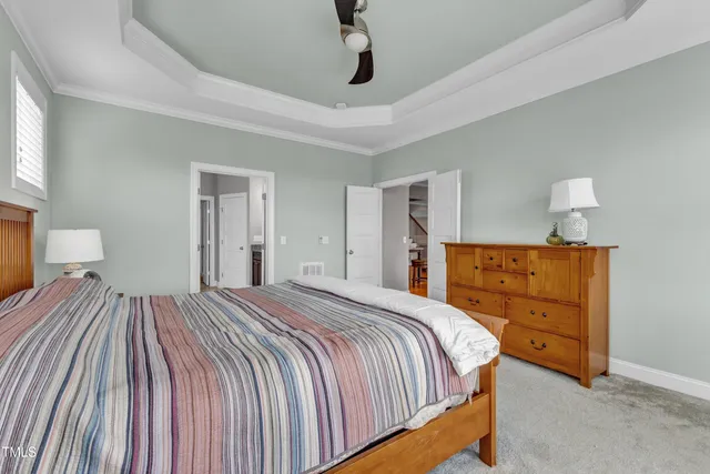 an aerial view of residential houses with outdoor space and parking