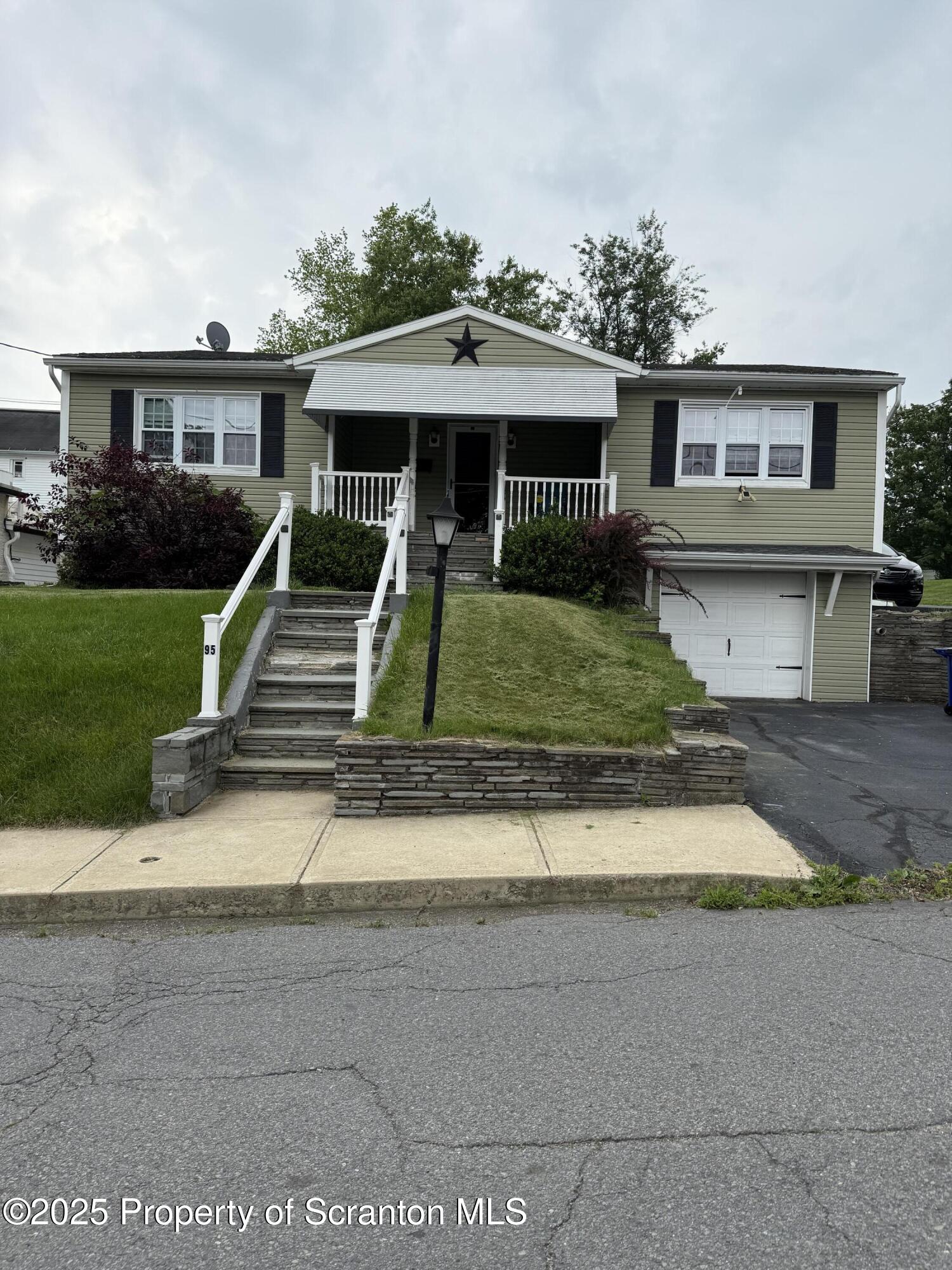 95 Farview Street Carbondale, PA 18407 - Photo 12 of 12 a front view of a house with a yard
