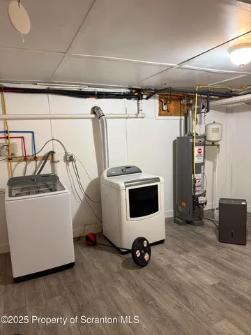 a utility room with washer and dryer