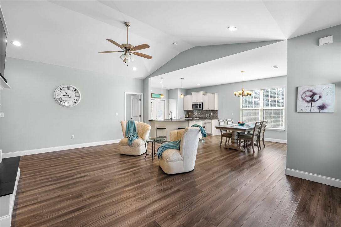 124 Inlet Pointe Drive Anderson, SC 29625 - Photo 12 of 50 Living area to dining area with vaulted ceilings