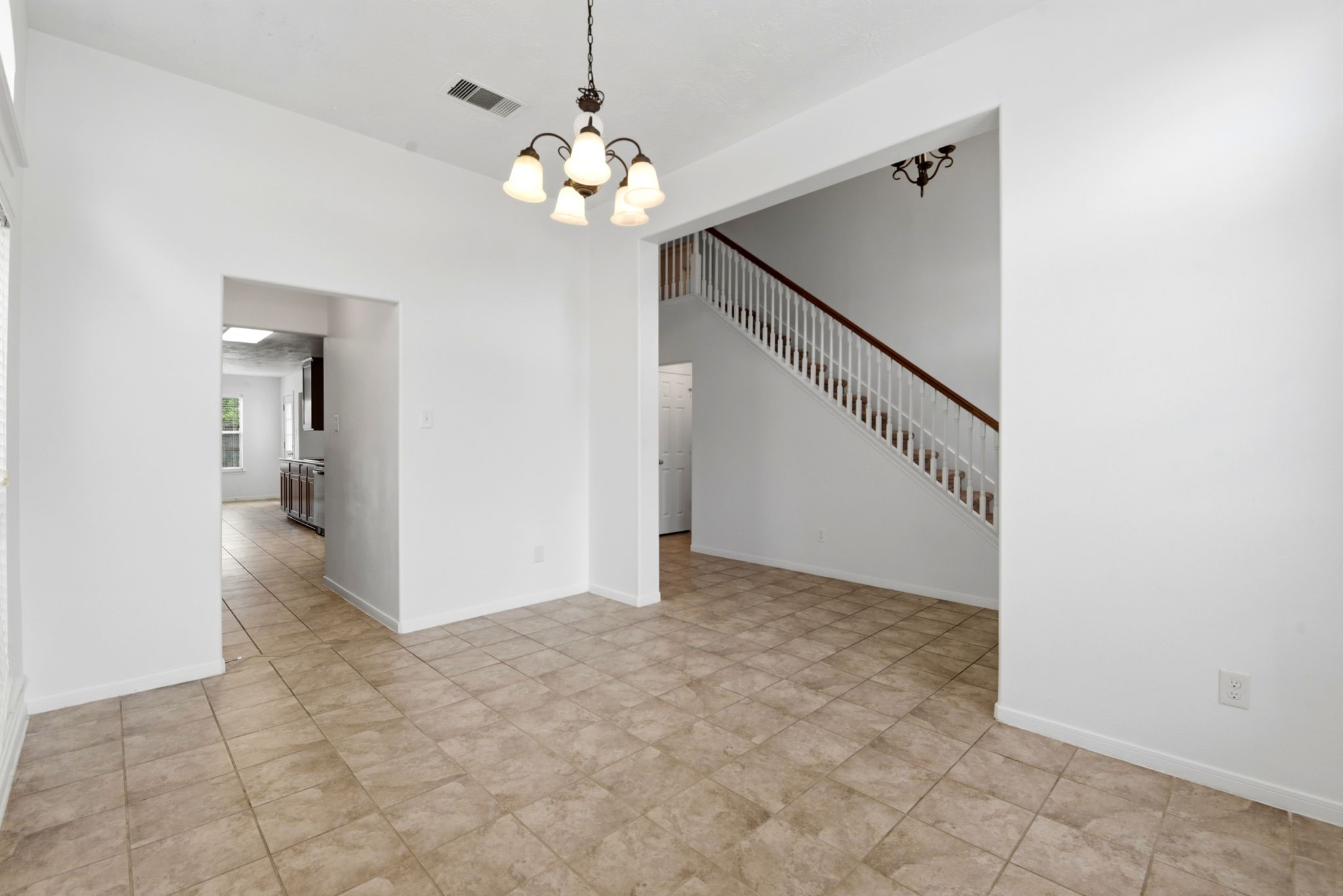 22102 Bridgestone Crossing Drive Spring, TX 77388 - Photo 6 of 38 a view of an empty room with wooden floor and staircase