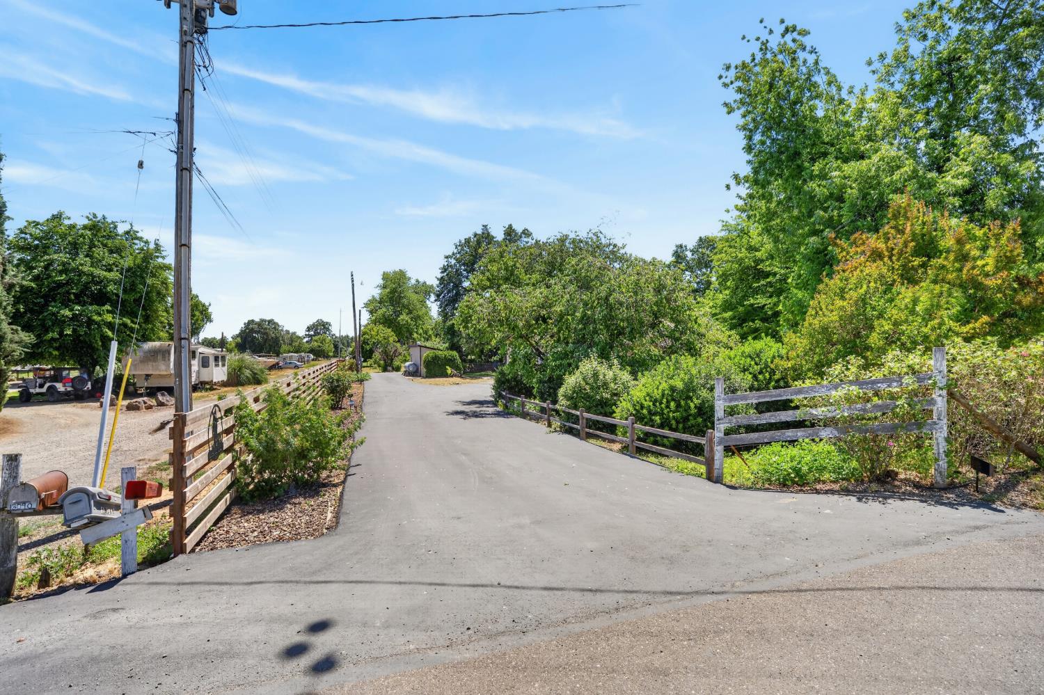 13088 Cherry Road Wilton, CA 95693 - Photo 47 of 58 New privacy fence along the paved driveway.