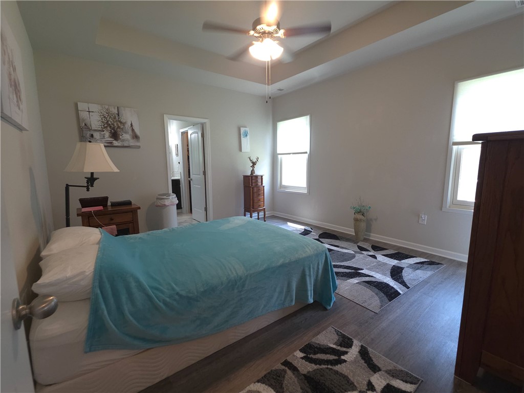 3 Cringle Lane Anderson, SC 29625 - Photo 9 of 26 Recessed ceiling and abundant natural light create a peaceful and open primary bedroom.