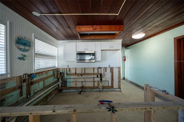 a kitchen with stainless steel appliances granite countertop a stove and a refrigerator