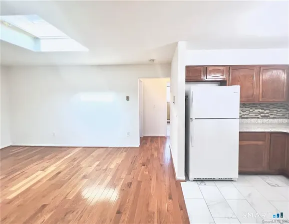 a view of kitchen with wooden floor