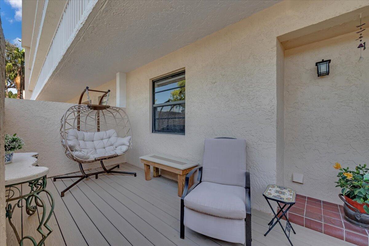 300 North Hwy A1A, Unit 103M Jupiter, FL 33477 - Photo 3 of 25 a room with furniture and wooden floor