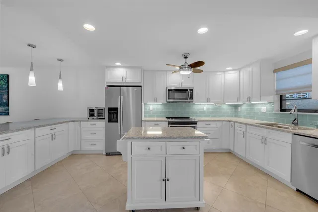 a large kitchen with cabinets