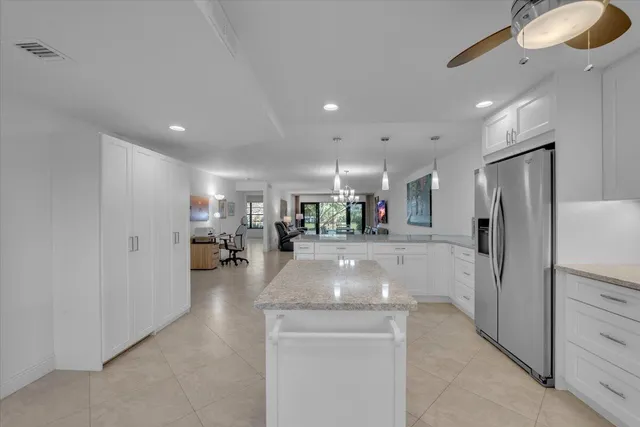 a view of a living room and chandelier