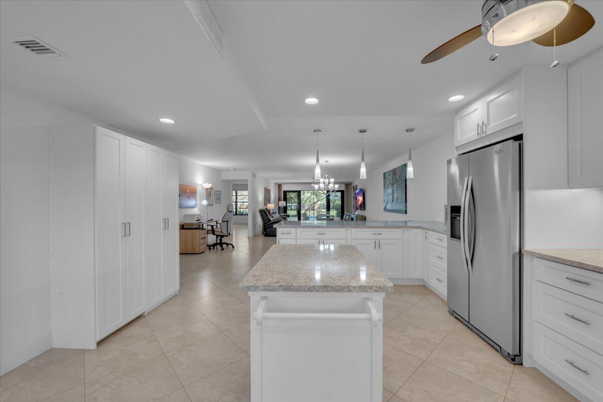 300 North Hwy A1A, Unit 103M Jupiter, FL 33477 - Photo 5 of 25 a view of a living room and chandelier