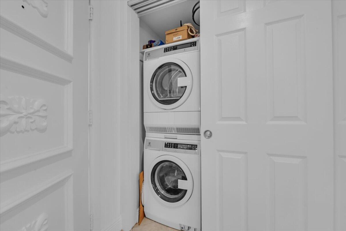 300 North Hwy A1A, Unit 103M Jupiter, FL 33477 - Photo 10 of 25 a utility room with dryer and washer