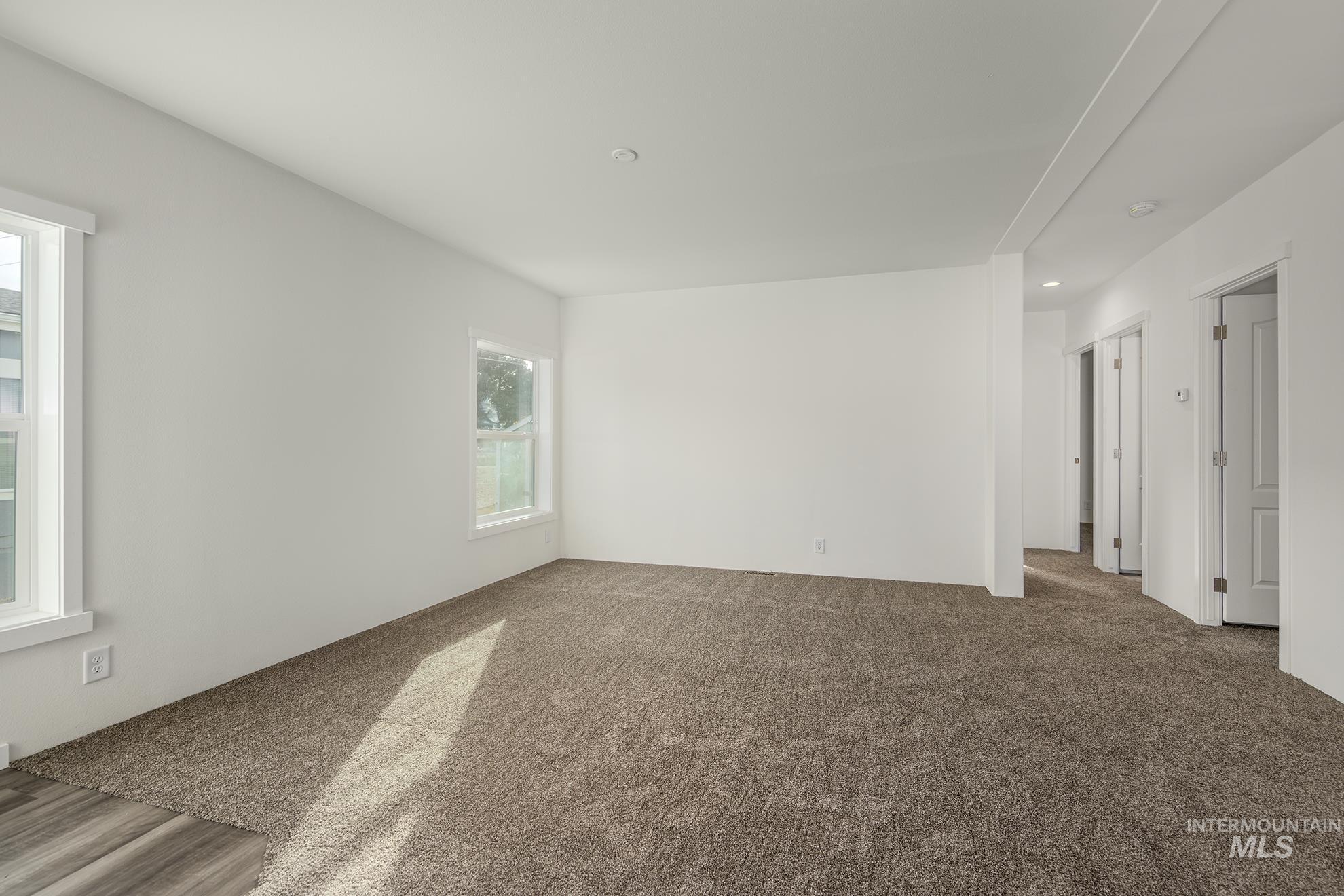 2750 Alden Road, Unit 8 8 Fruitland, ID 83619 - Photo 12 of 31 Carpeted empty room featuring recessed lighting