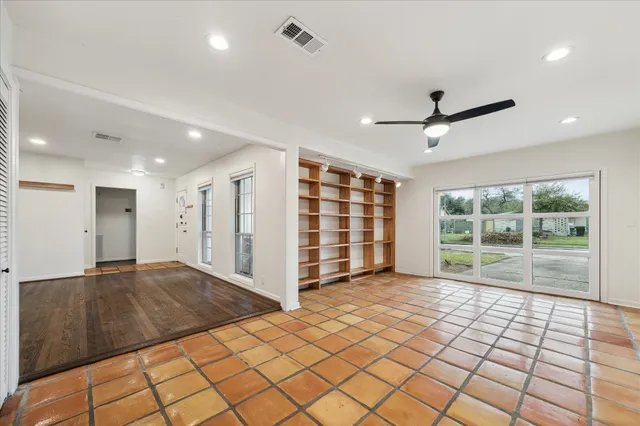 a view of an empty room with a large window