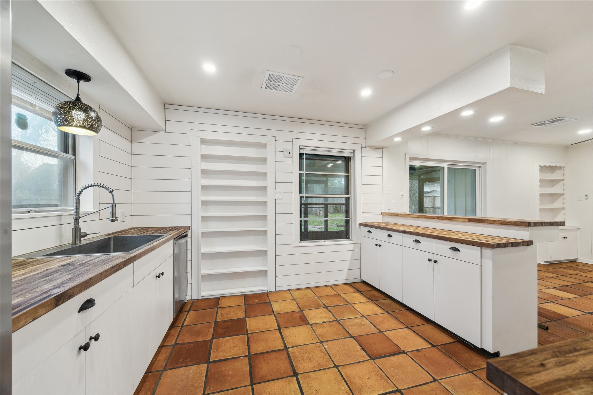 7262 Roos Road Houston, TX 77074 - Photo 13 of 25 a bathroom with a sink a vanity and a mirror