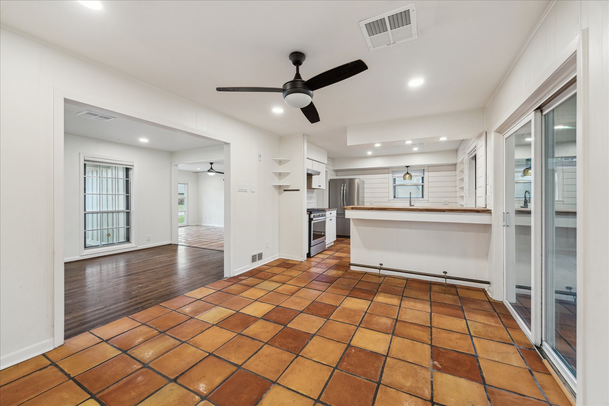 7262 Roos Road Houston, TX 77074 - Photo 16 of 25 a room view with wooden floor and windows
