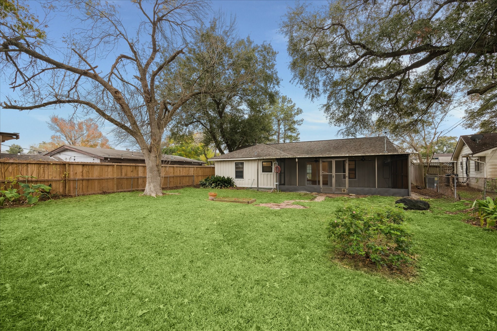 7262 Roos Road Houston, TX 77074 - Photo 7 of 25 a view of a house with yard and a garden