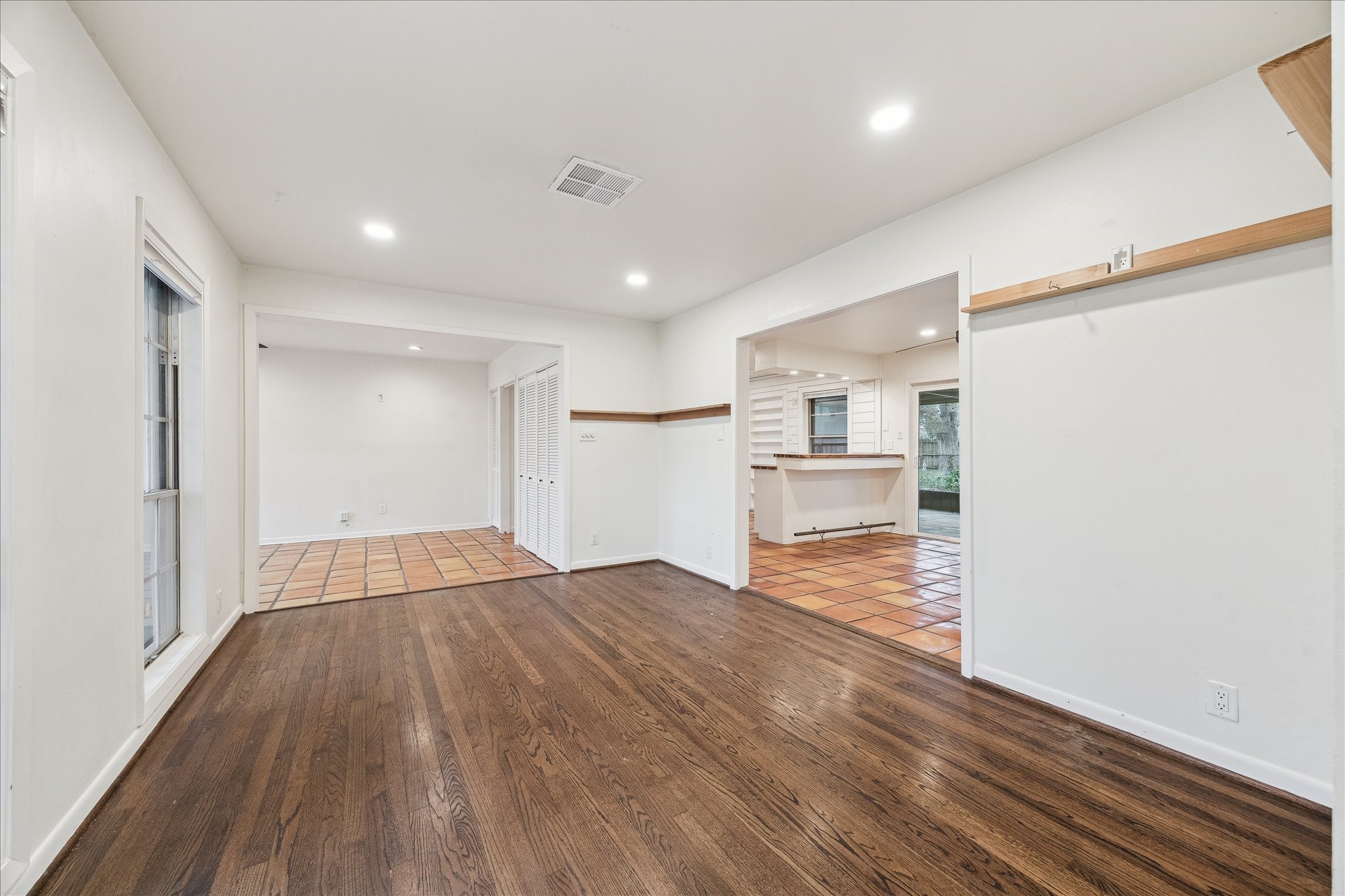 7262 Roos Road Houston, TX 77074 - Photo 9 of 25 a view of kitchen and wooden floor
