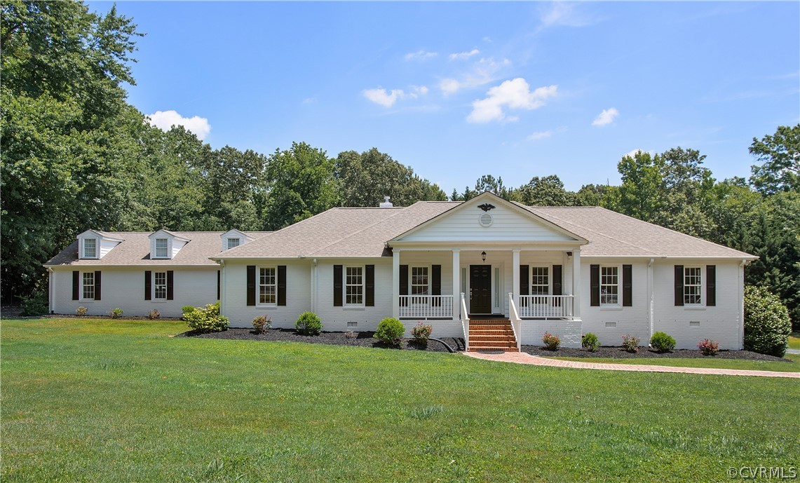 1503 Black Heath Road Midlothian, VA 23113 - Photo 1 of 50 a front view of a house with a garden and trees