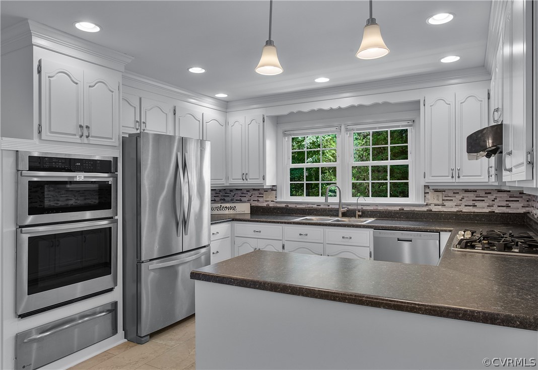 1503 Black Heath Road Midlothian, VA 23113 - Photo 15 of 50 a kitchen with stainless steel appliances granite countertop a refrigerator a stove a sink and a microwave