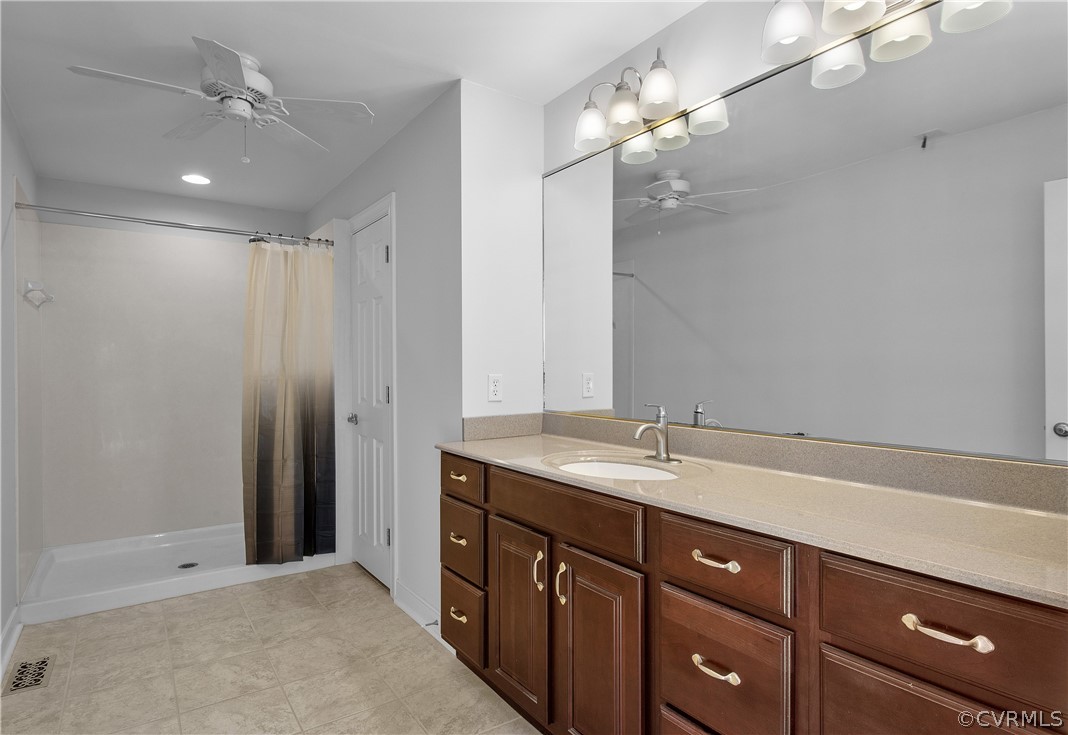 1503 Black Heath Road Midlothian, VA 23113 - Photo 24 of 50 a spacious bathroom with a granite countertop sink a mirror and a shower