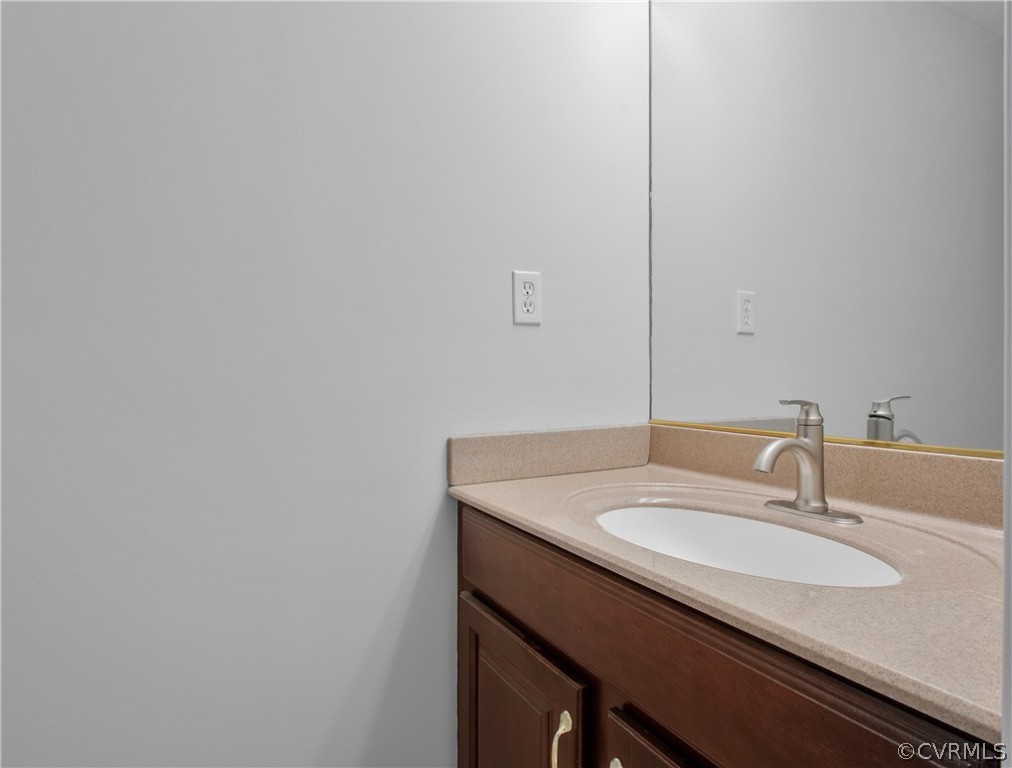 1503 Black Heath Road Midlothian, VA 23113 - Photo 25 of 50 a bathroom with a sink and a mirror