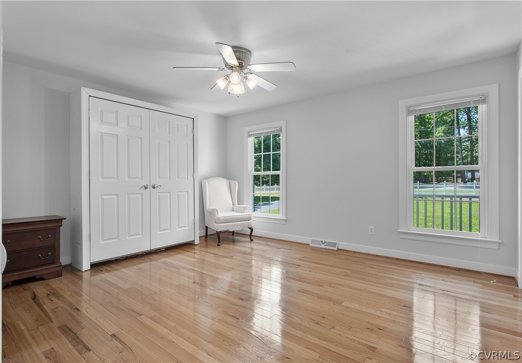 1503 Black Heath Road Midlothian, VA 23113 - Photo 26 of 50 an empty room with wooden floor fan and windows