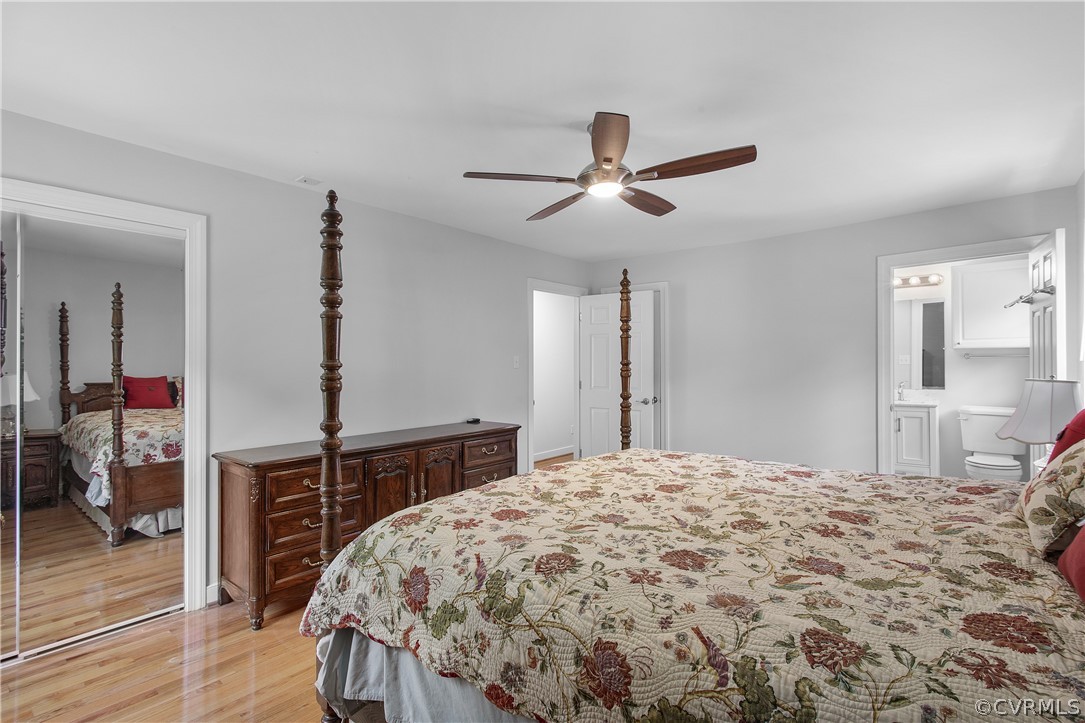 1503 Black Heath Road Midlothian, VA 23113 - Photo 28 of 50 a bedroom with a bed and a chandelier