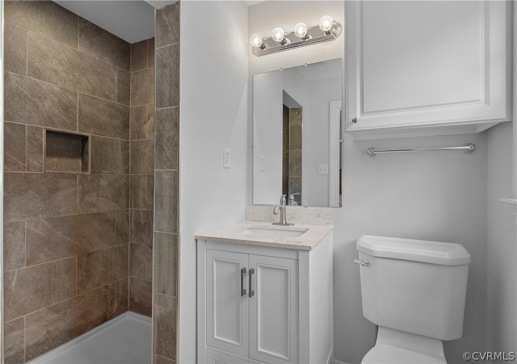 1503 Black Heath Road Midlothian, VA 23113 - Photo 29 of 50 a bathroom with a sink a toilet and shower