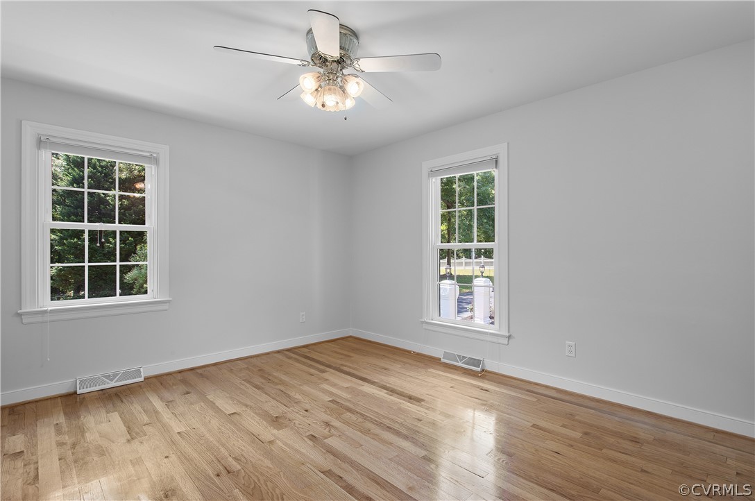 1503 Black Heath Road Midlothian, VA 23113 - Photo 30 of 50 an empty room with wooden floor cabinet and windows