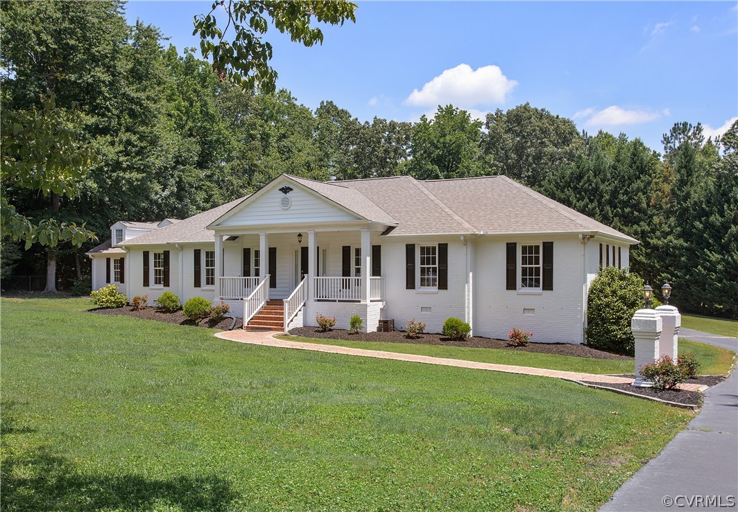 1503 Black Heath Road Midlothian, VA 23113 - Photo 49 of 50 a front view of a house with a garden and trees